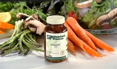 Standard Process Catalyn bottle with fresh vegetables